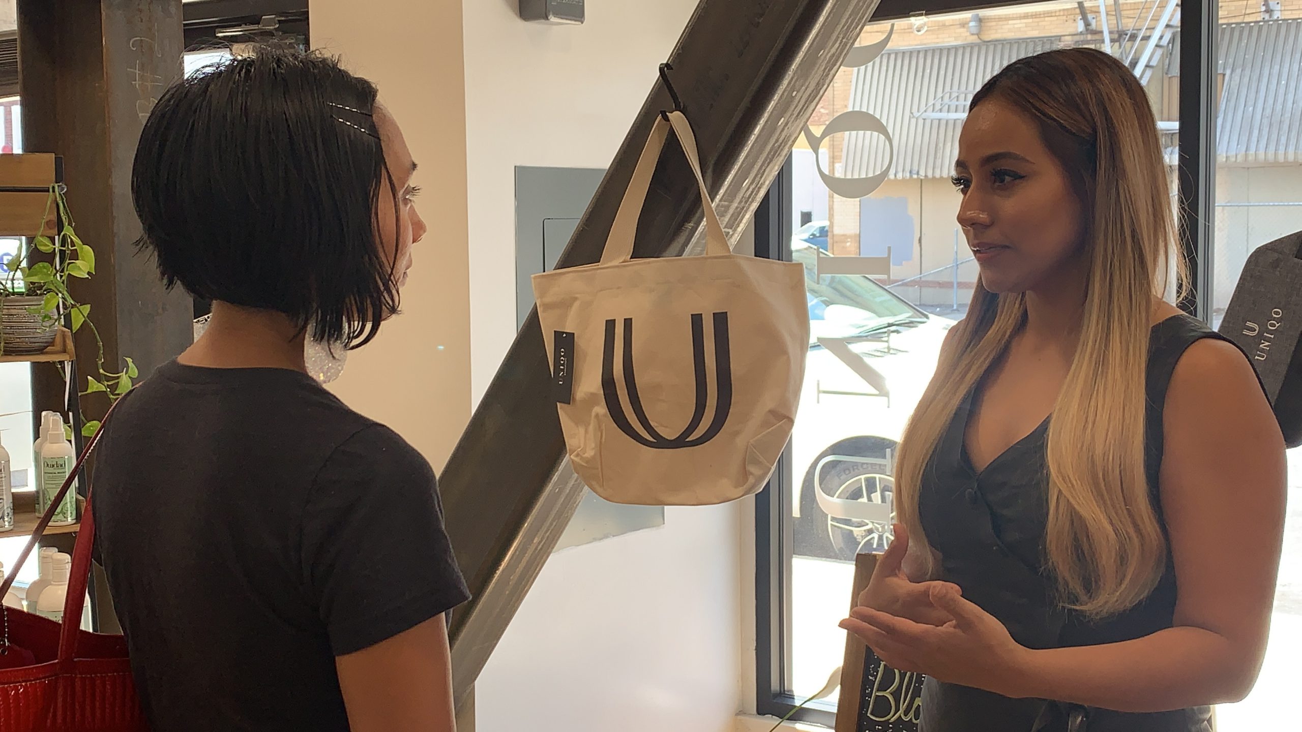 Patty Ayala, owner of Uniqo Salon, speaking with performer and entrepreneur, Renee Icasiano.
